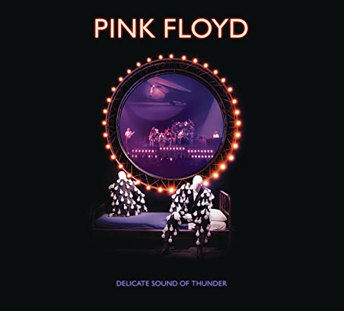 Pink Floyd album cover: stage lights framing figures on beds.