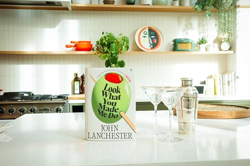 Book with white cover, black text, and bold title font, likely a paperback novel.