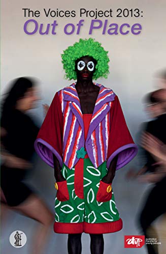 Person in vibrant, patterned clothing with green hair, blurred figures nearby.