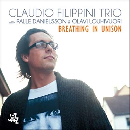 CD cover featuring Claudio Filippini, a musician with glasses, in portrait.
