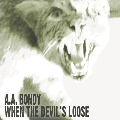 Close-up of a snarling animal face with album title text below.