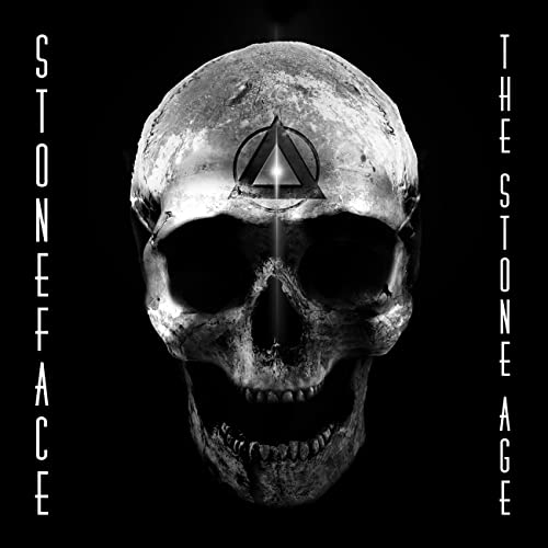 Skull with a triangular symbol over the eyes, dark background.