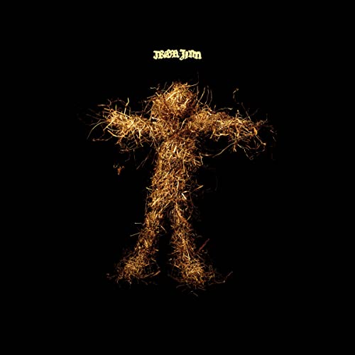HumanCS Humanoid figure made of golden straw or dried grass against a black background.