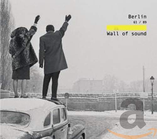 Black and white photo of people near a wall, CD cover art.