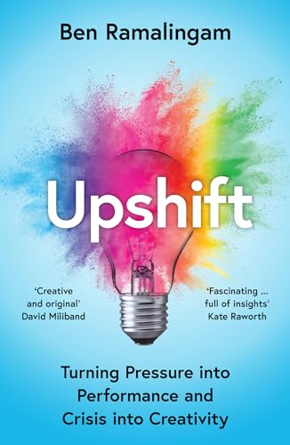 Book cover: “Upshift” with a lightbulb and colorful explosion imagery.
