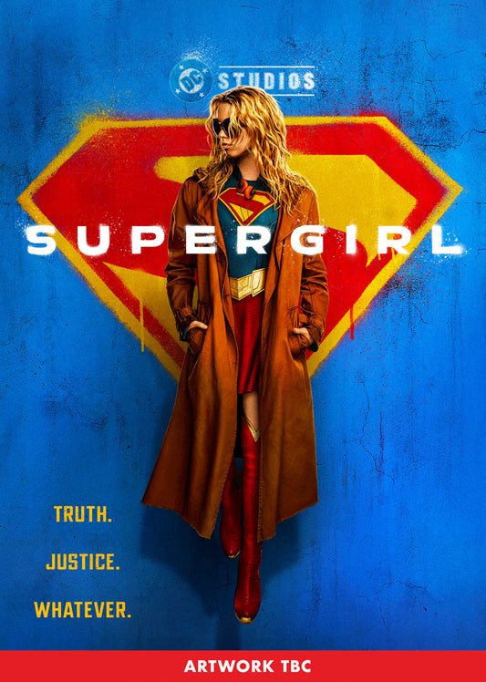 Supergirl wearing a trench coat and sunglasses in front of a large Superman logo.