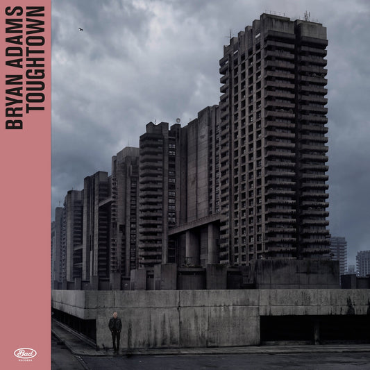 Bryan Adams' "Tough Town" CD cover: Brutalist buildings and a lone figure.