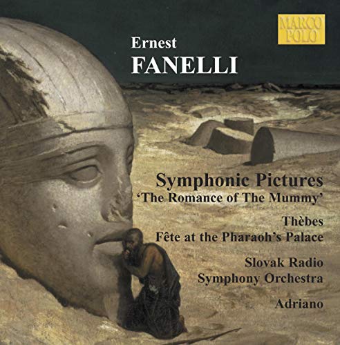 CD cover featuring a large stone head and a seated figure in a desert.