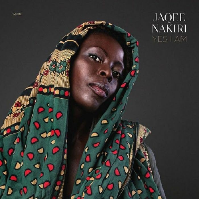 Close-up portrait of Jaqee Nakiri with patterned headwrap, album cover.