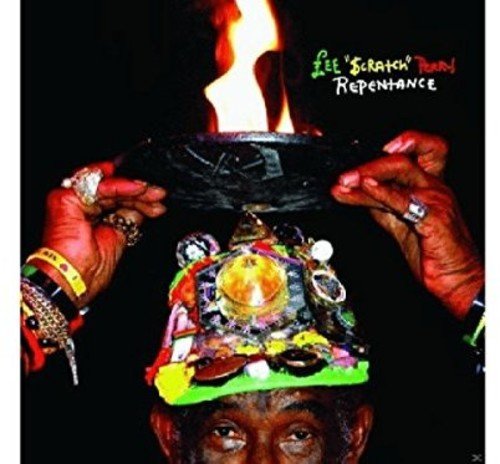Vinyl record cover featuring hands holding a decorated skull with a flame.