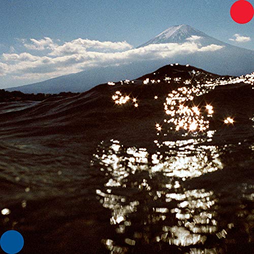 Album cover: snow-capped mountain with red and blue circles.