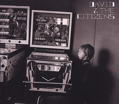 Black and white CD cover with pinball machines and a child.
