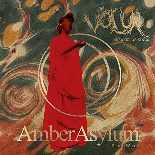 Vinyl album cover featuring a red-robed figure and swirling marbled background.