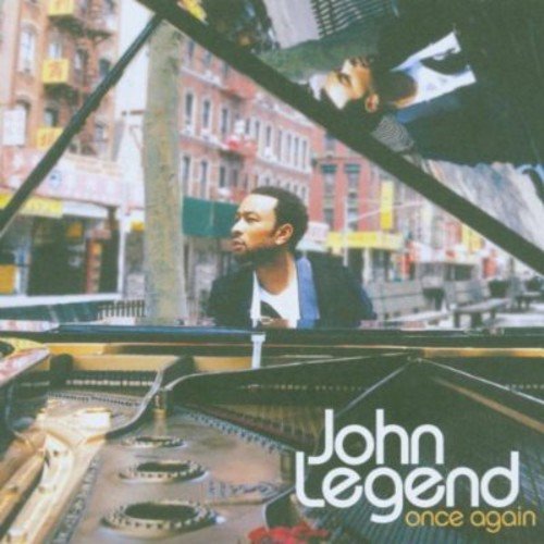 John Legend album cover featuring the artist at a piano.