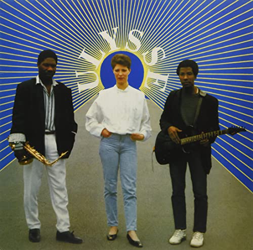 Album cover featuring three people with musical instruments against a blue burst.