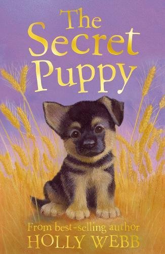 Book cover featuring a small, fluffy brown and black puppy in wheat.
