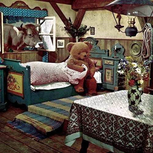 Vintage-style album cover featuring a teddy bear in a rustic bedroom.