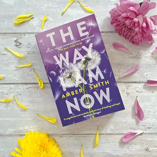 The book The Way I Am Now by Amber Smith on a wooden surface.