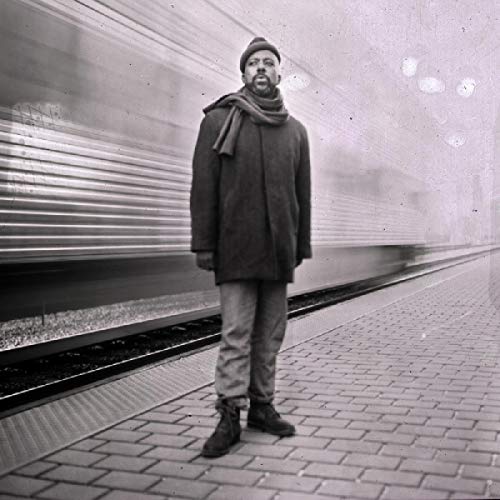 Black and white portrait of Ben Lamar Gay standing on a train platform.