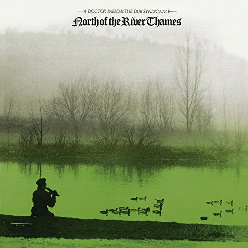 Album cover: foggy landscape with a man playing a flute by water.