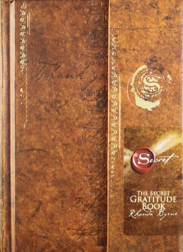 Brown leather-look journal with embossed text and a spiral design.