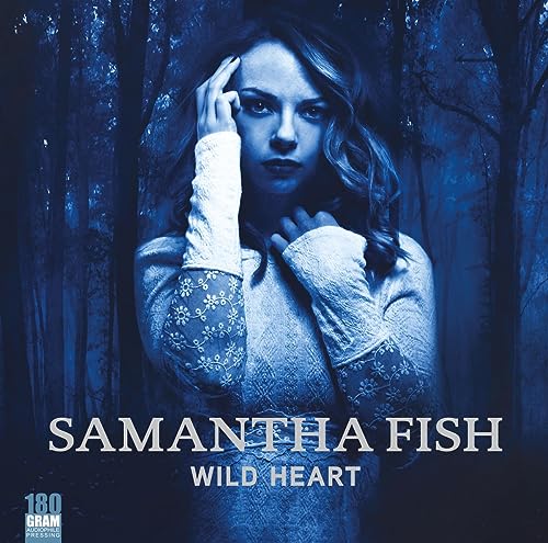 Samantha Fish album cover, woman in a forest, blue tones, vinyl record.