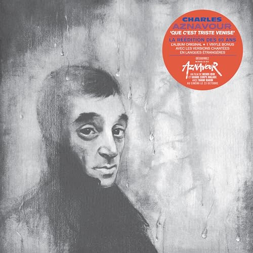 Black and white portrait of Charles Aznavour with a red sticker overlay.