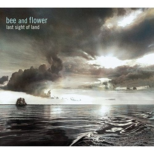 CD cover: stormy seascape with dark clouds and small island.