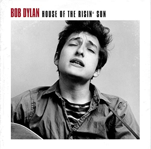 Black and white portrait of Bob Dylan, eyes closed, singing.