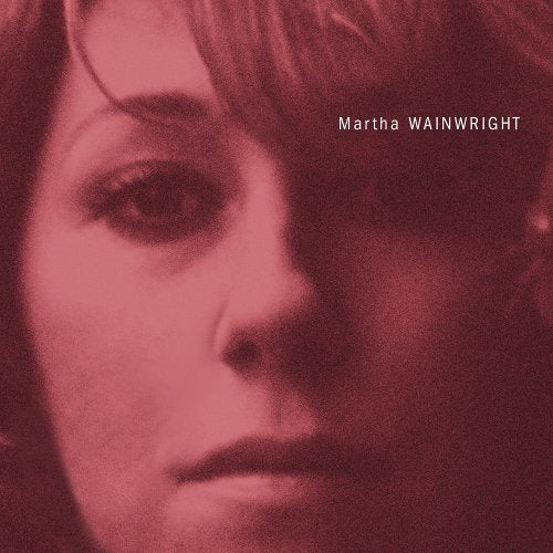 Close-up portrait of Martha Wainwright in a monochromatic dark red tone.
