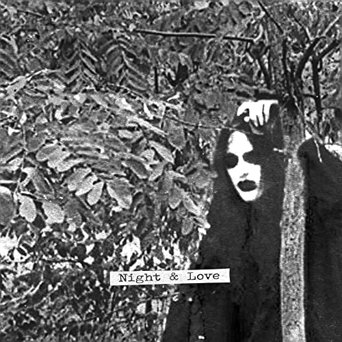 Black and white album cover featuring a person in dark clothing among trees.