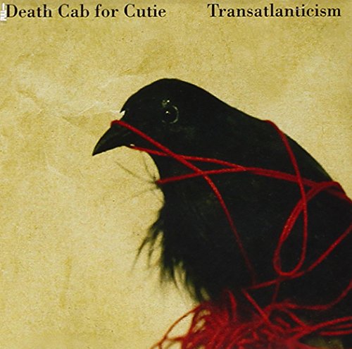 CD cover: a black bird with red string wrapped around its head.