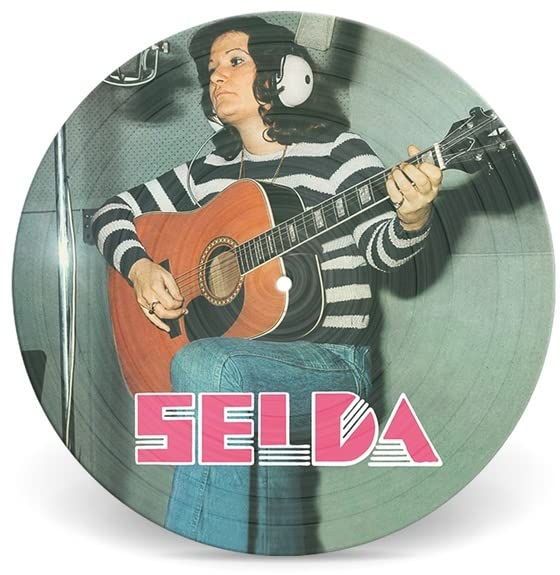 Vinyl record featuring Selda Bağcan playing guitar, striped shirt, pink text.