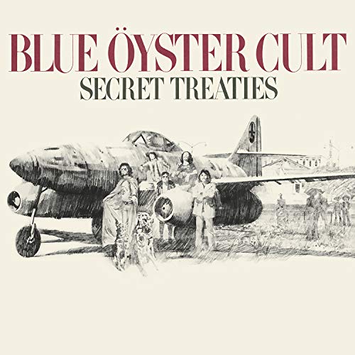 Blue Oyster Cult album cover: band posing with a vintage jet aircraft.
