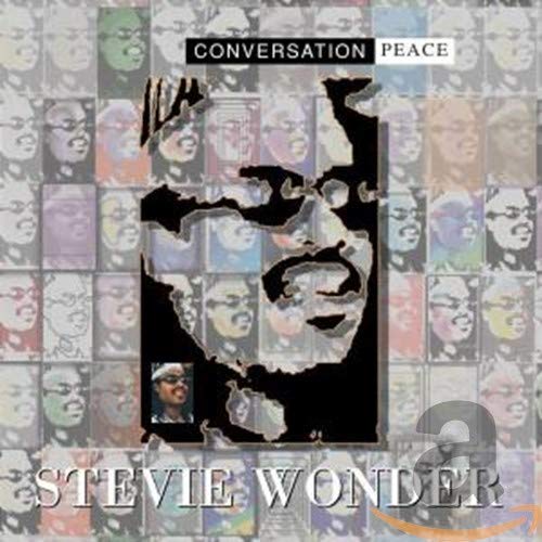 Stevie Wonder's "Conversation Peace" CD cover with faces and map imagery.