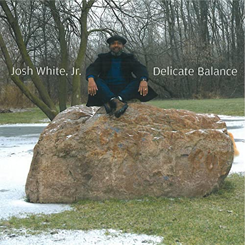 Josh White Jr. album cover: man seated on a large rock.