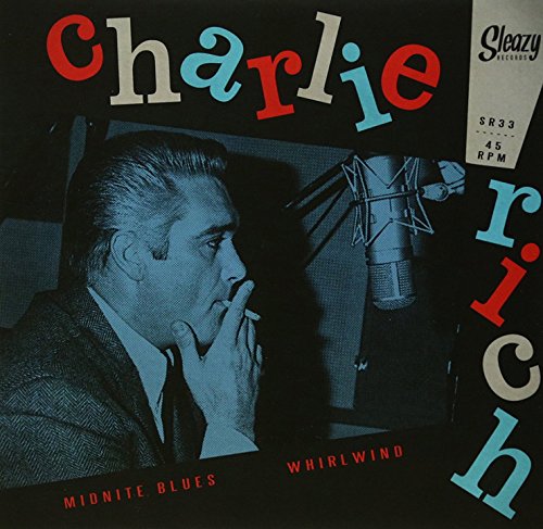 Record cover featuring Charlie Rich at a microphone, with bold text.