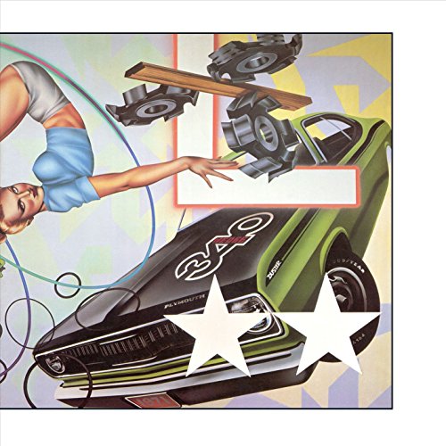 1980s album cover featuring a green car, speakers, and a woman’s arm.