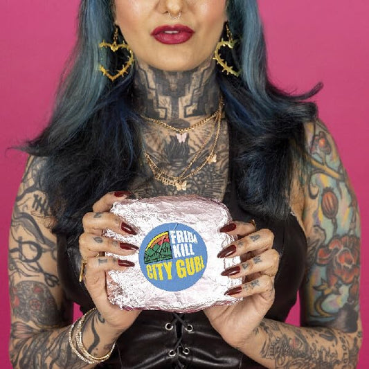 Woman with tattoos holding a silver-wrapped vinyl record, “City Gurl”.