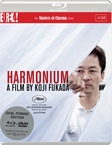 Blu-ray cover for Harmonium, featuring a man peering from behind a white sheet.