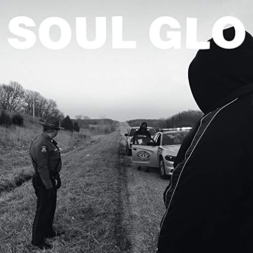 Black and white album cover depicting a roadside encounter with police.