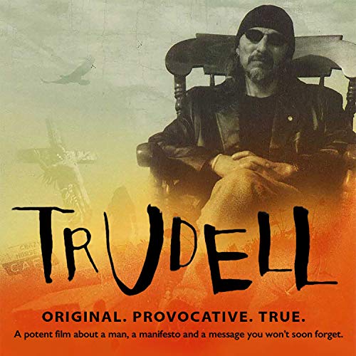 John Trudell portrait on DVD cover with planes and orange text.