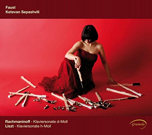 CD cover: Woman in red dress amongst broken piano keys.