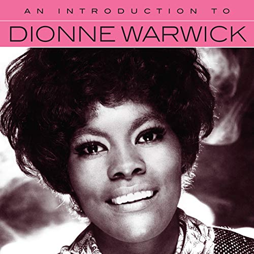 Close-up of Dionne Warwick with dark hair, smiling on album cover.