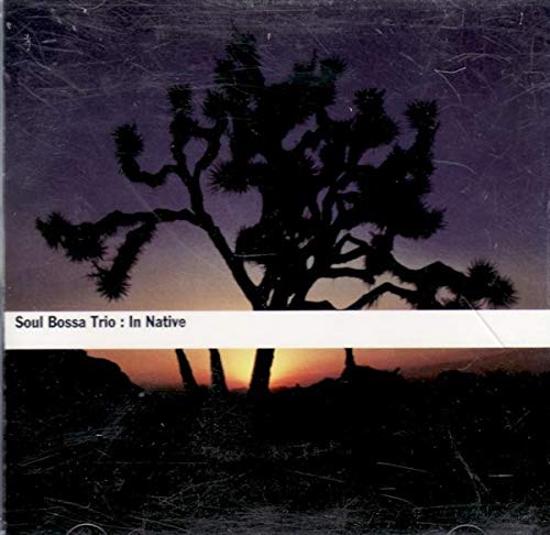 CD cover: desert landscape with silhouetted tree at sunset.