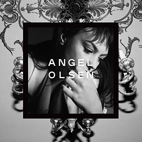 Black and white portrait of Angel Olsen with text overlay against ornate architectural background.