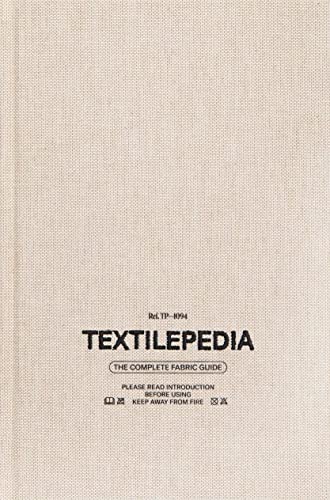 Book with fabric swatches and textile information, likely with a neutral color cover.