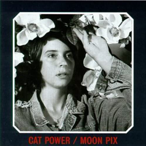 Black and white album cover of Cat Power's Moon Pix showing a woman among flowers.