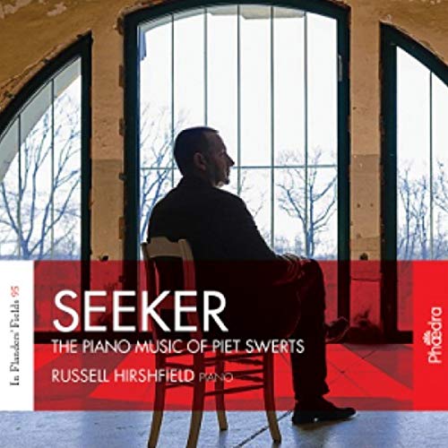 Man seated with back to viewer before arched windows, album cover.