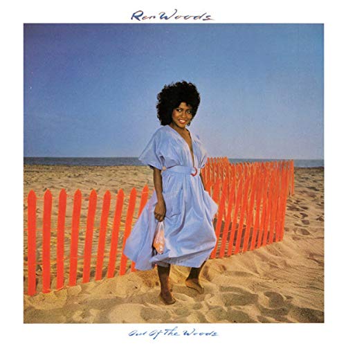Ren Woods album cover: woman on beach with orange fence.